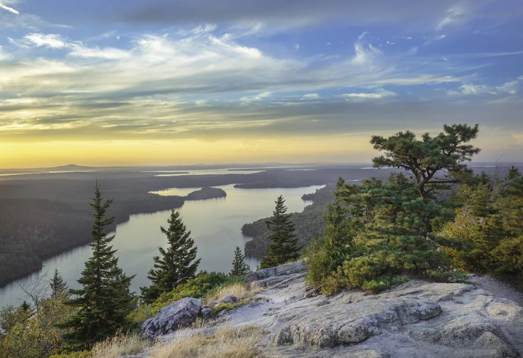 a lake is seen from a top mountain terrain