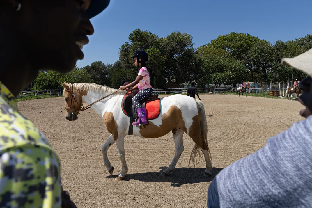 Skylar Sultan works on her riding position in a lesson.