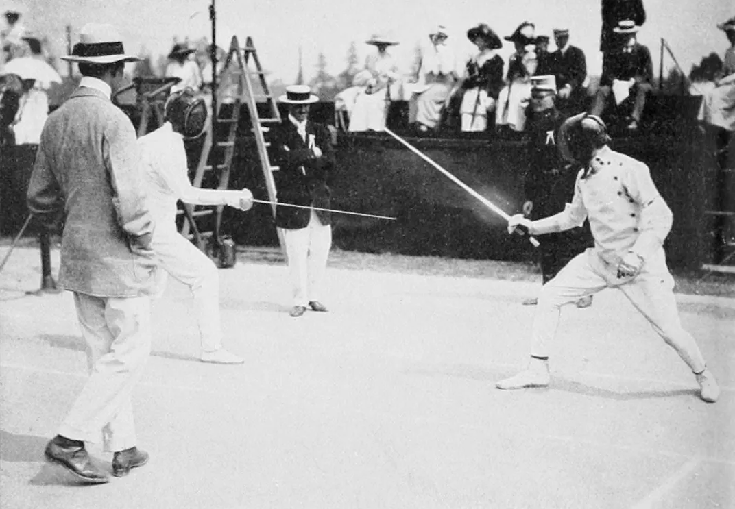 Patton (right) competes in the fencing section of the pentathlon at the 1912 Olympics.