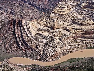 The Green River carves the landscape at Mitten Park fault, exposing rock layers formed more than a billion years ago – long before the dinosaurs.