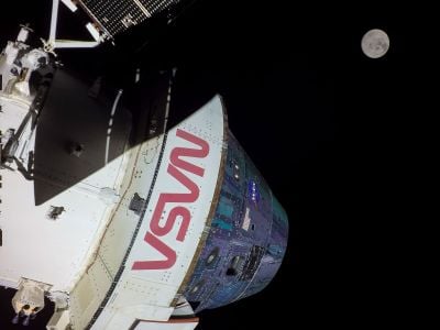 A camera mounted on the Orion spacecraft captured the moon just in frame on December 4, 2022. NASA plans to use Orion as part of a mission to return astronauts to the lunar surface.