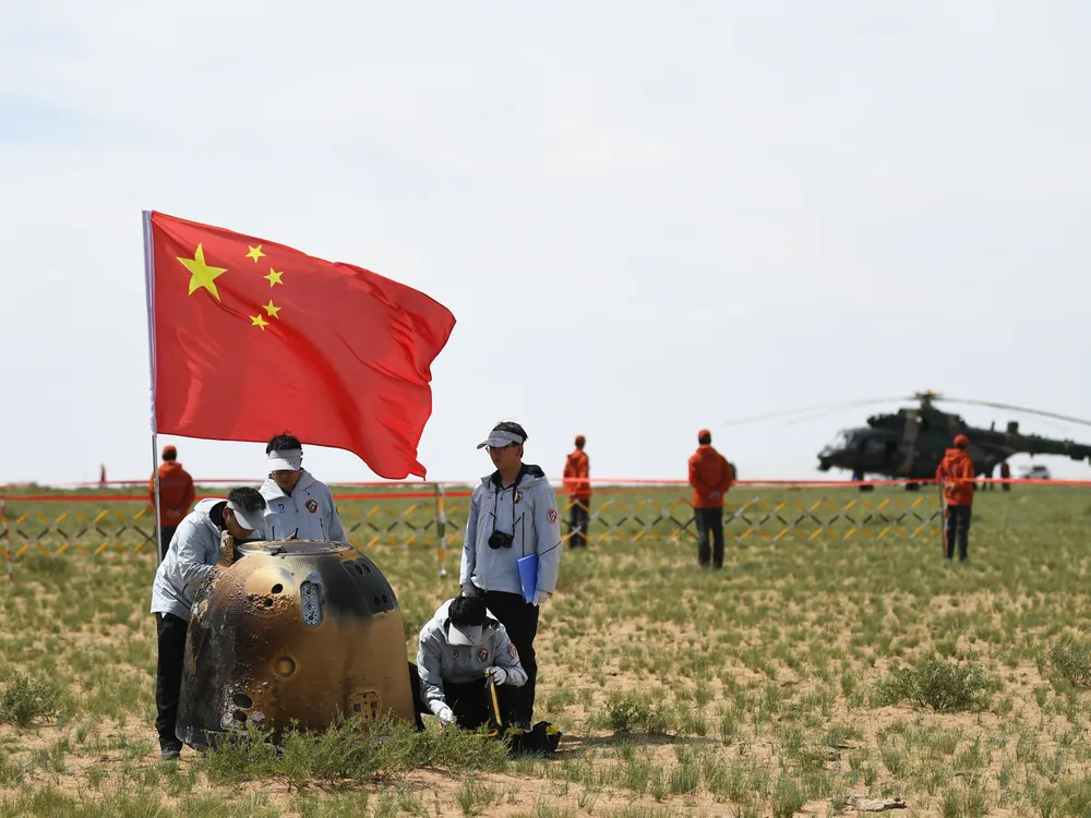 The return capsule of the Chang'e-6 probe lands on June 25, 2024, with lunar samples inside.