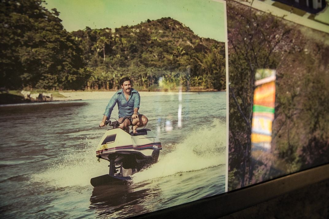 Escobar jet-skiing on a lake on the property.