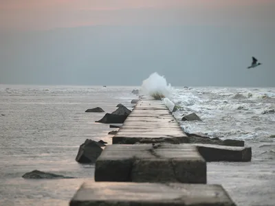 Water breaks against Galveston Island&rsquo;s century-old seawall. The barrier was an engineering marvel in the early 1900s, but the island needs more protection today.