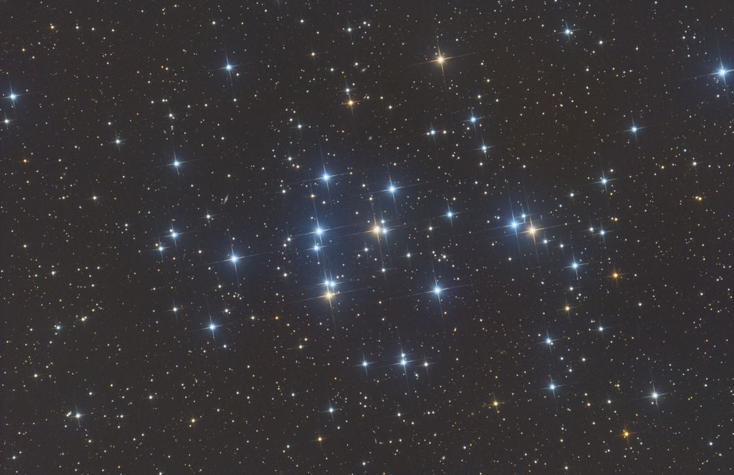 a grouping of blue and yellow stars loosely clustered together