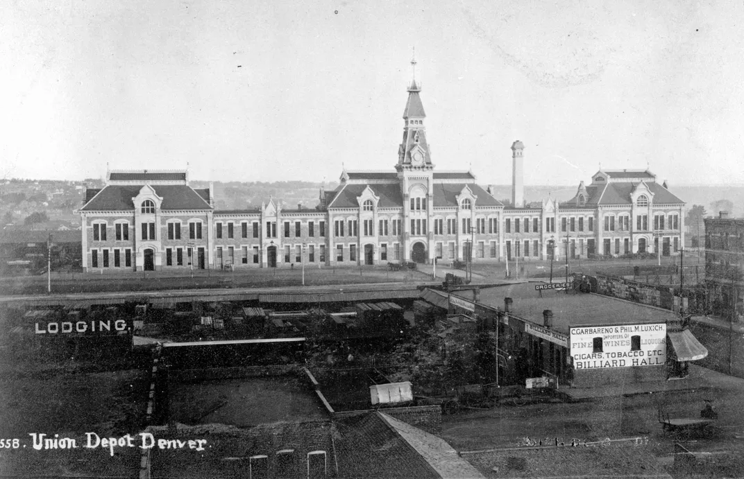 Black and white photo of a large train station